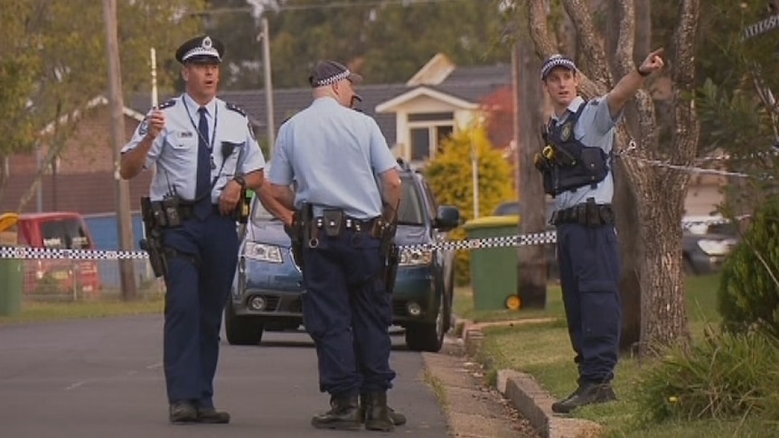 Police attend the scene of the dispute at Yagoona in Sydney's south-west.