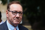 Actor Kevin Spacey wearing glasses 