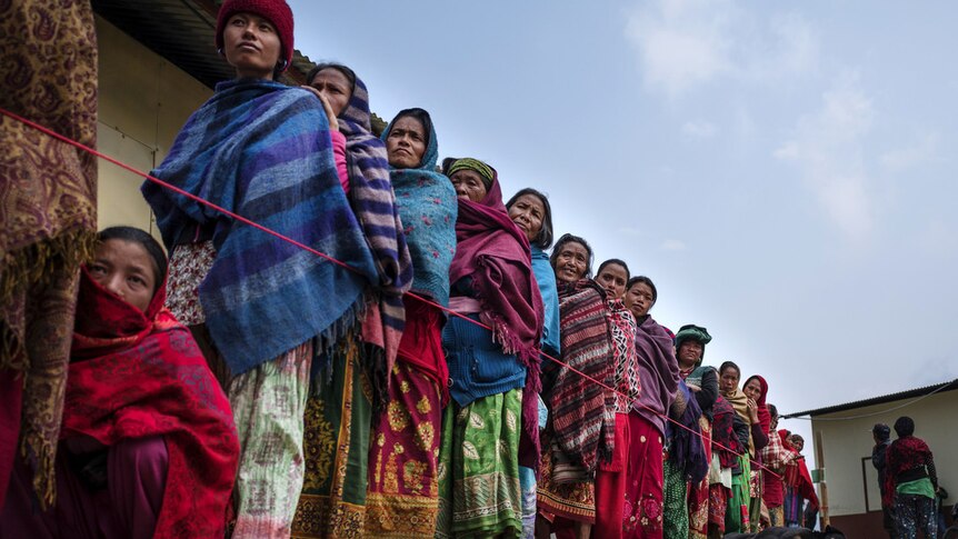 Nepal women queue at Oxfam shelter