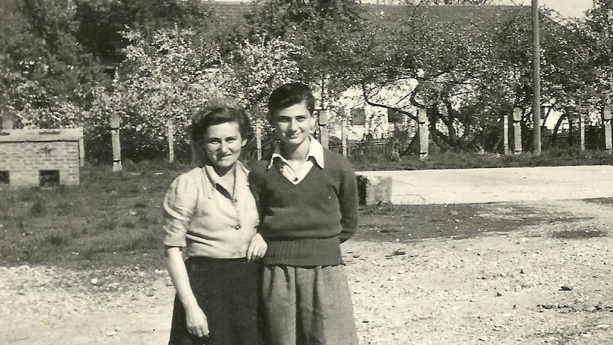 Frank Vajda standing with his mother Maria at a refugee camp in Austria
