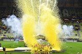 Yellow confetti flies in the air as Villarreal players celebrate with the trophy after winning the Europa League final.
