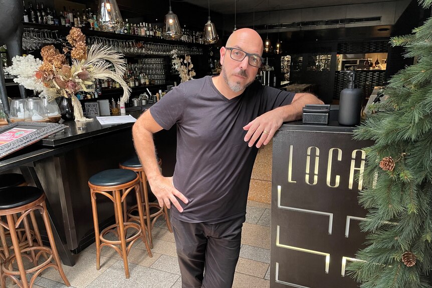 Rio Capurso leans against a counter in his Locale restaurant business at Noosa.