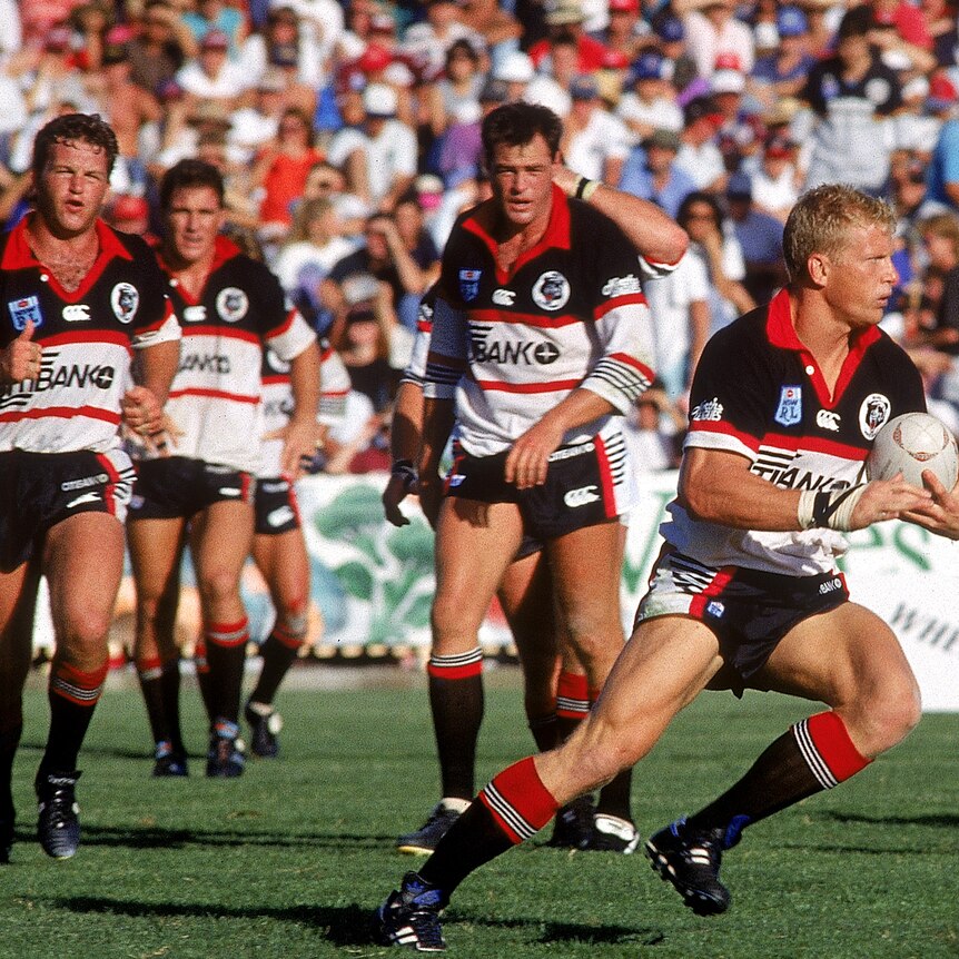 A group of rugby league players during a match