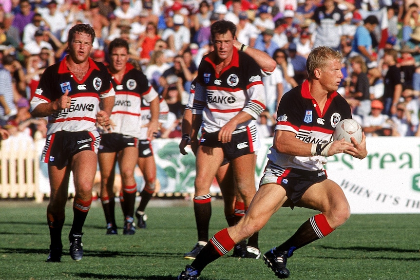 A group of rugby league players during a match