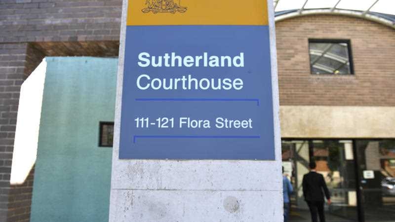 A sign outside a building that reads Sutherland Courthouse.