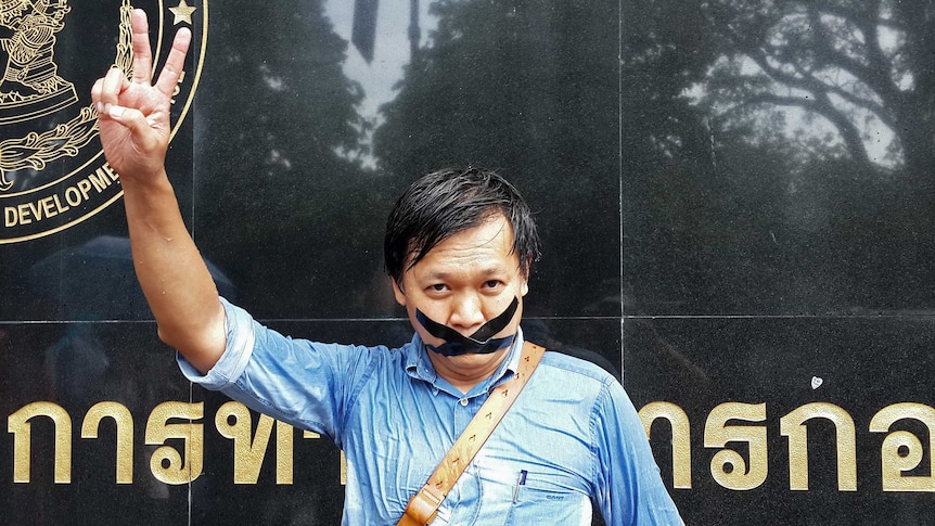 Pravit Rojanaphruk outside a military base in Bangkok where he had been summoned.