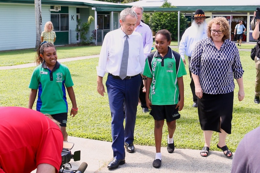Bill Shorten walks with Indigenous students at Cairns West State School.
