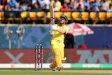 A man hits a shot during a cricket match