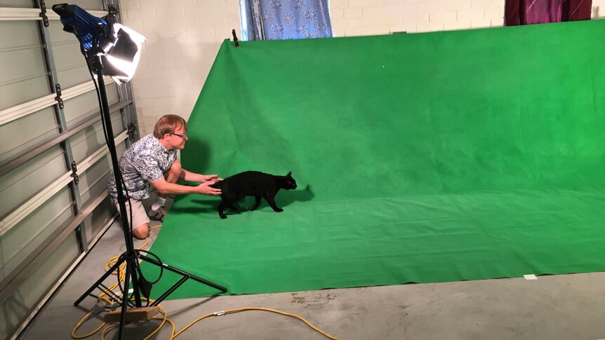 Adelaide filmmaker James Kurtze with his cat.