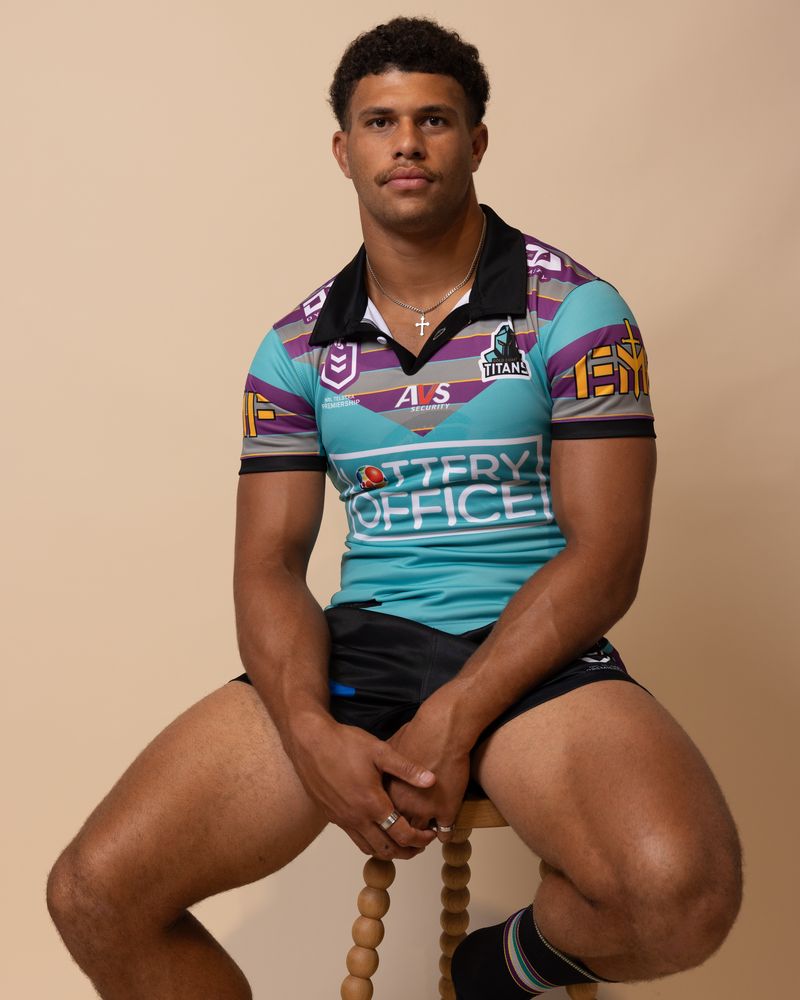 A player looks on while modelling a jersey 
