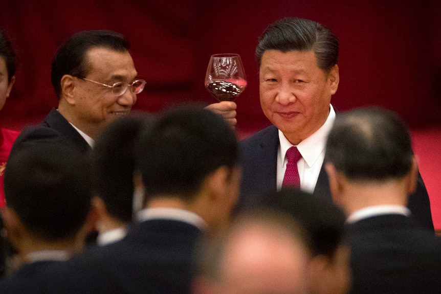 Xi Jinping raises a glass of red