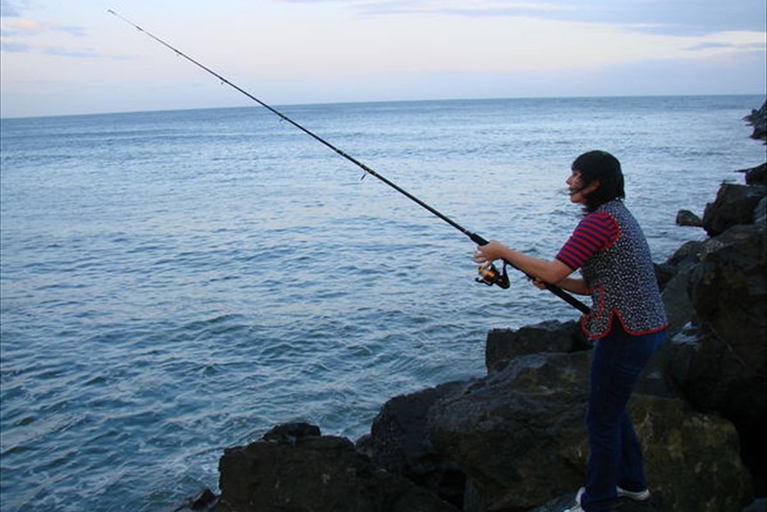 Fisherman on the rocks