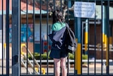 A girl outside a school