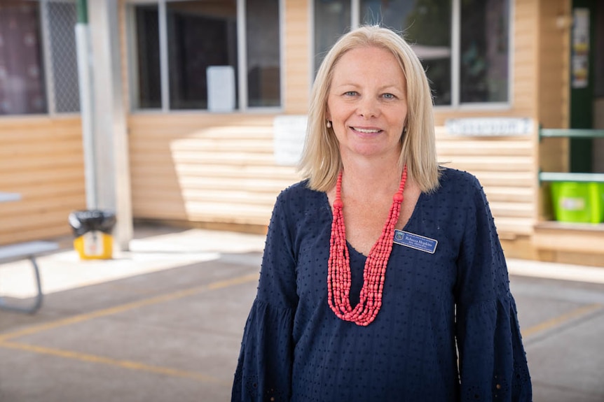 Murrurundi Public School Principal Rebecca Hopkins stands in a shaded area.