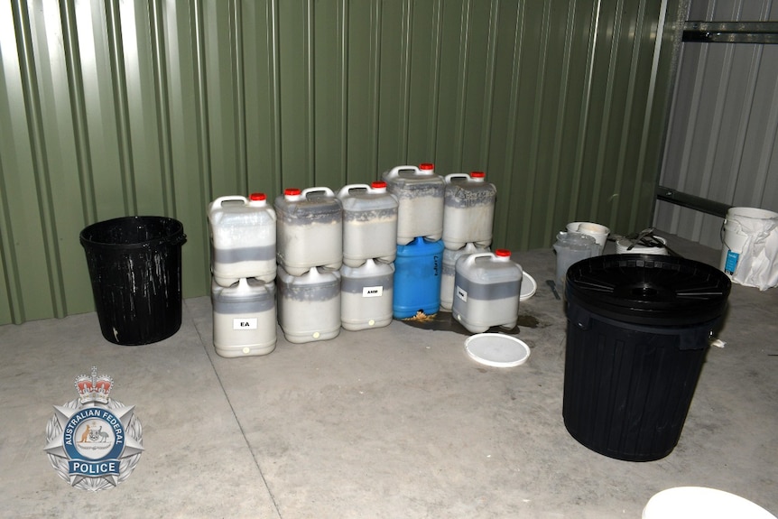 buckets of chemicals in a shed 