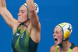 Australia's women's water polo team celebrates poolside against the Netherlands.