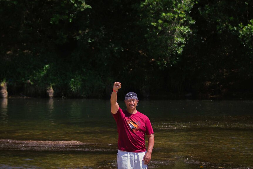 Man standing next to river