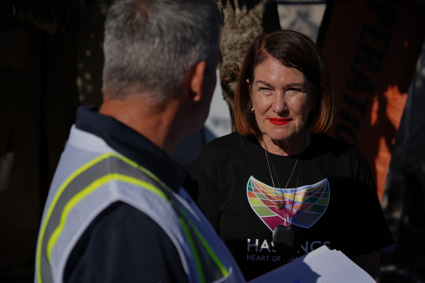 Sandra Hazlehurst, Hastings District Council Mayor, speaking to a male.