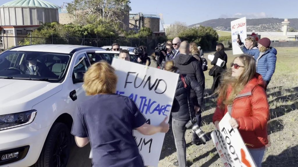 Protesters shout at PM after funding boost to Hobart stadium press ...