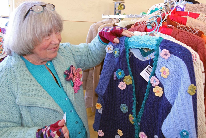 Mary Louise Burns and some of her woollen creations