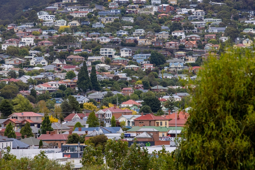 View over Hobart suburbs to Dynyrrne and Southern Outlet, June 2023 