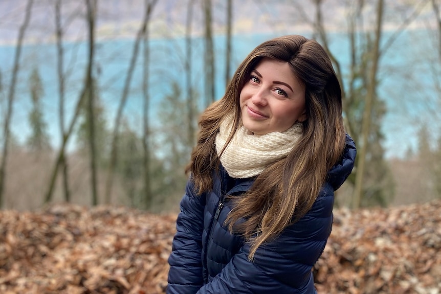 Holly, 29, poses for a photo in nature