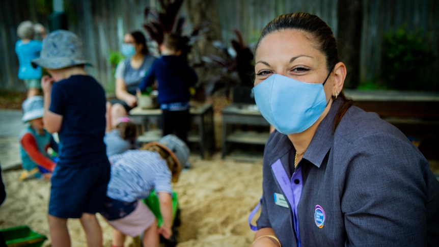 A woman in a childcare setting. 