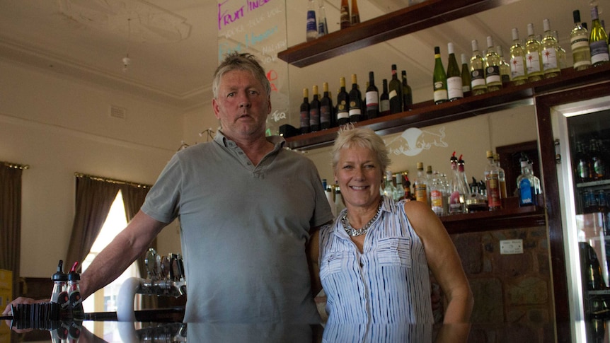 Husband-and-wife publicans Craig and Jenny Alderdice stand in the cocktail bar of their pub, the Kalgoorlie Hotel.