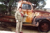 Woman with old truck.
