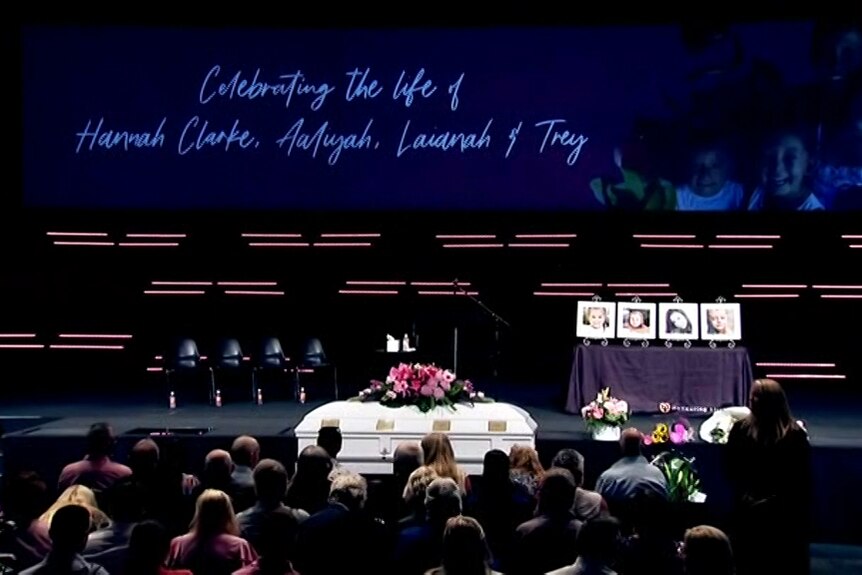Coffin sits in front of the congregation.