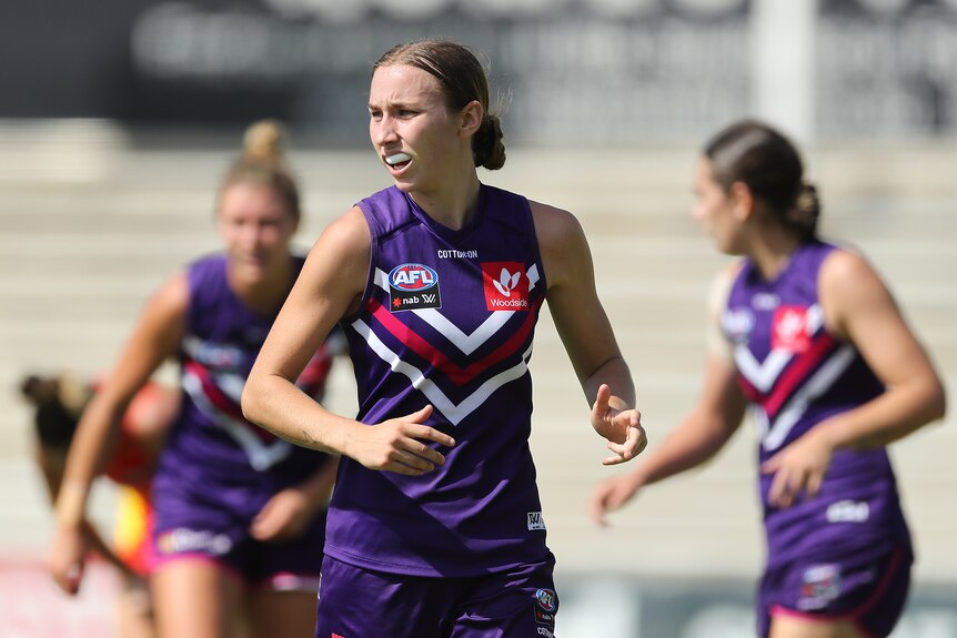 Sarah Verrier looks to the side during an AFLW match.