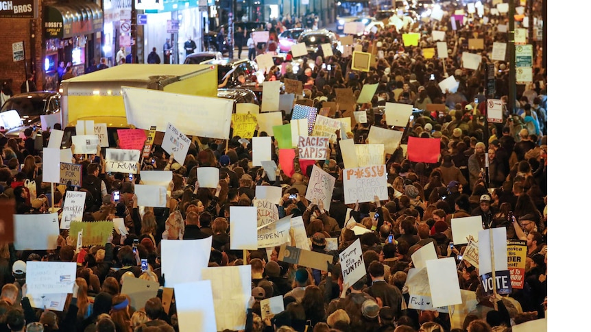 Protesters walk during a protest against Republican president-elect Donald Trump in Chicago.