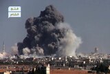 Black smoke rises from a suicide bomb attacked Syrian government.