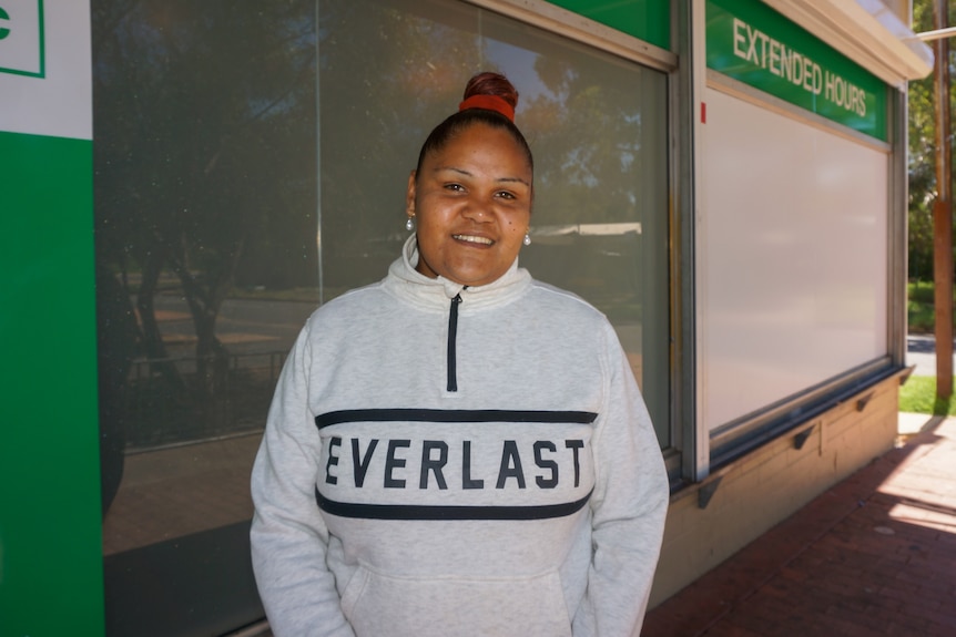 an aboriginal woman wearing an Everlast jumper