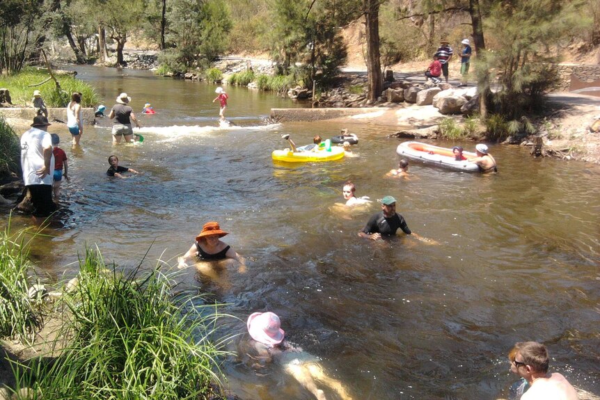 Swimmers at the Cotter Avenue recreation area in ACT during summer. Generic hot weather.