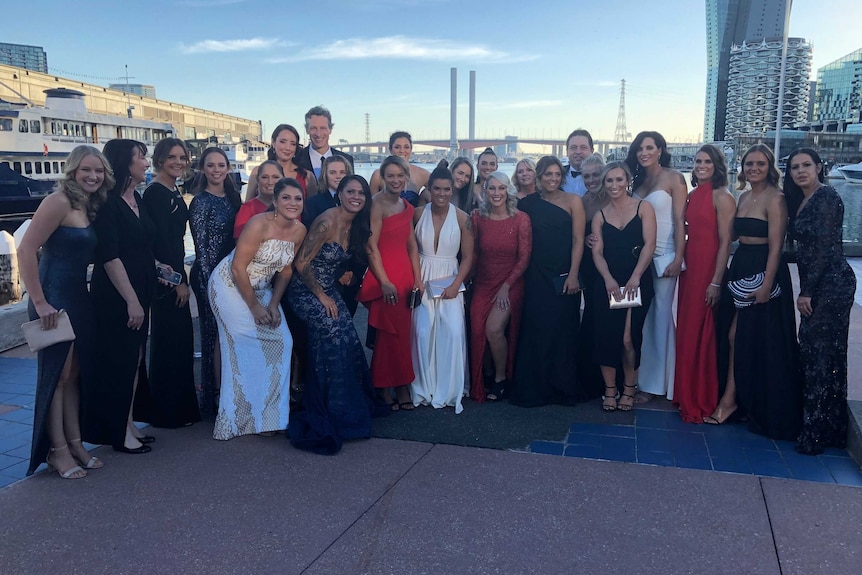 Women in gowns on the Yarra banks