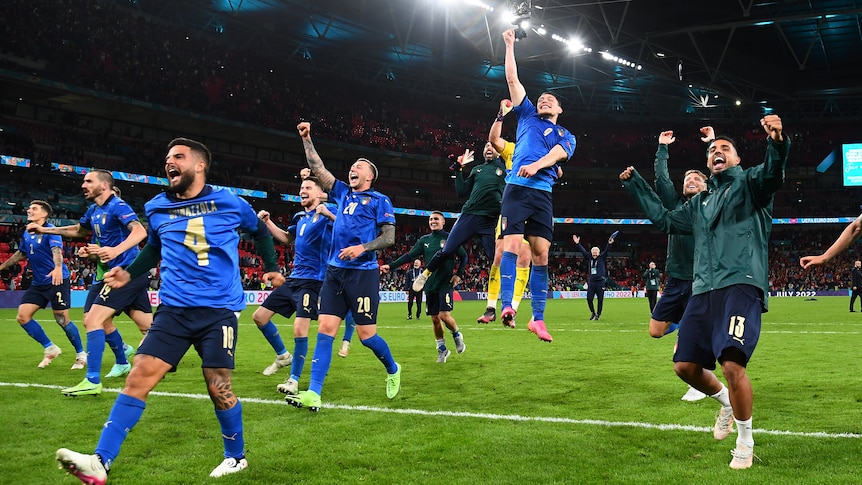 Italy players run and leap for joy in celebration