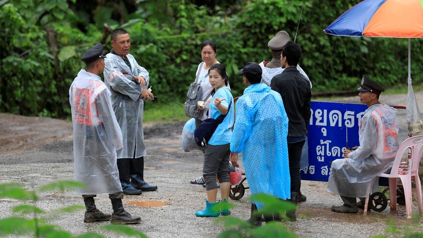 Relatives of trapped boys  at a check point near the Tham Luang cave complex.