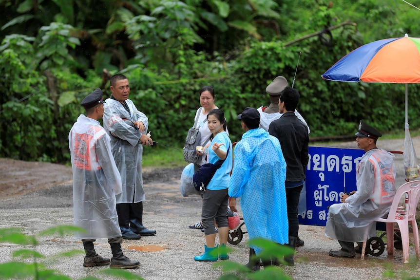 Relatives of trapped boys  at a check point near the Tham Luang cave complex.