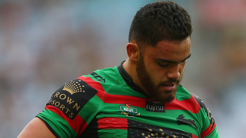 South Sydney's Dylan Walker looks at his injured hand against Wests Tigers