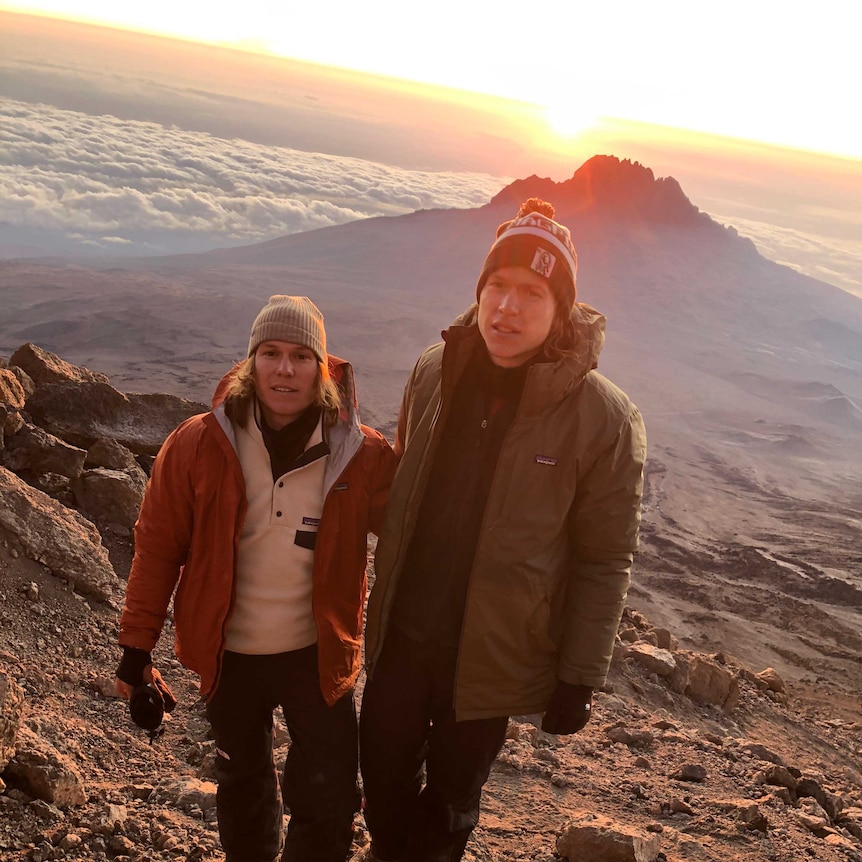 Ed Langdon and brother Tom stand on a mountain side in Tanzania.