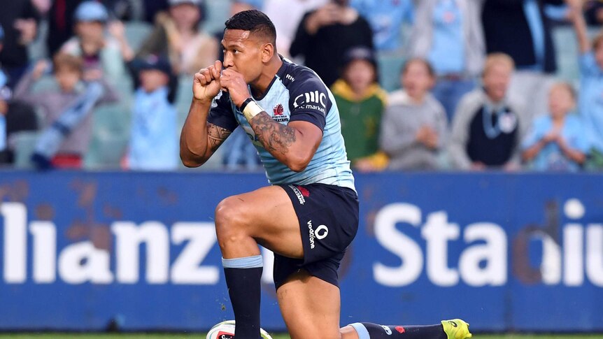 Israel Folau celebrates a try for the Waratahs