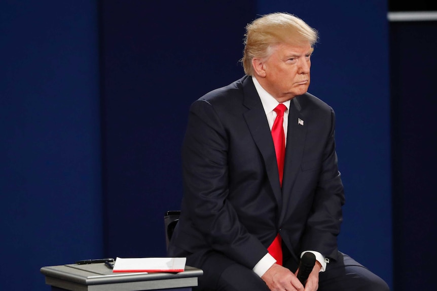 Donald Trump sitting during the second presidential debate in St Louis.