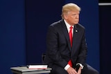 Donald Trump sitting during the second presidential debate in St Louis.