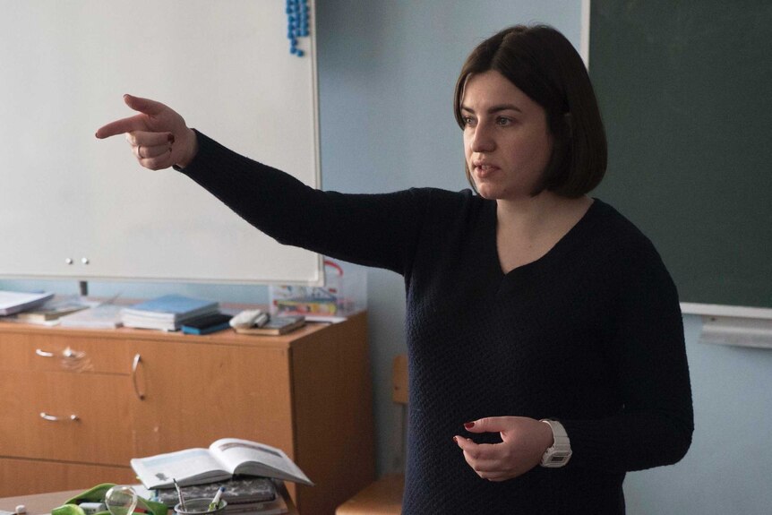 Alexandra Zorina teaches a room of primary students in Russia