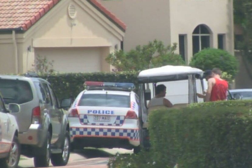 Police at the Hope Island home on Qld's Gold Coast where an 18-month-old boy died when being run over by the car