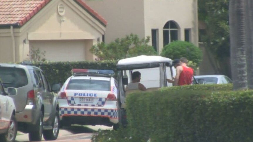 Police at the Hope Island home on Qld's Gold Coast where an 18-month-old boy died when being run over by the car