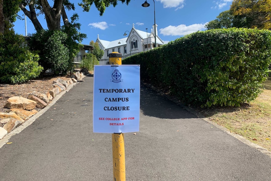 Sign outside a school says "Temporary Campus Closure"