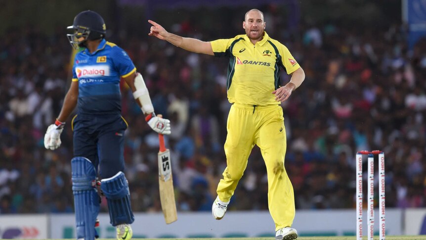 Australia's John Hastings (R) celebrates the wicket of Sri Lanka's Dilruwan Perera in Dambulla ODI.