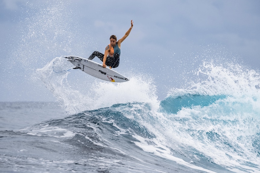 Molly Picklum surfing